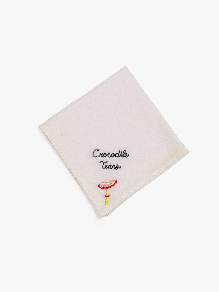One of the set of five 8-inch-by-8-inch 100% cotton handkerchiefs in white with black embroidered text and colorful characters in the bottom corner.