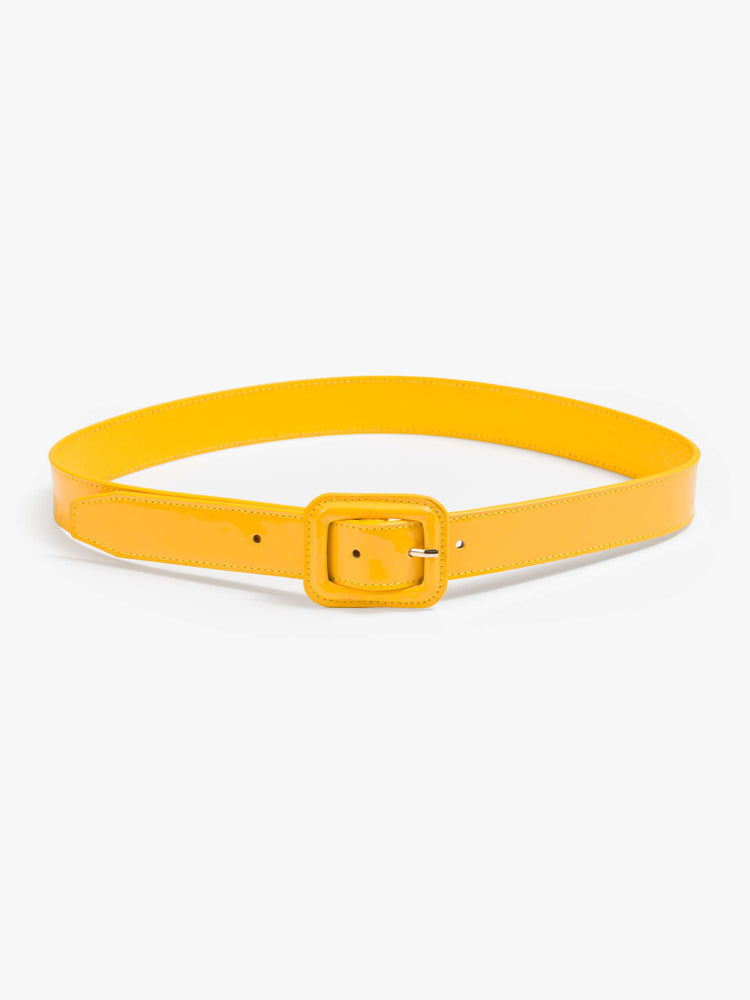Flat view of a yellow patent leather belt with an oversized square buckle. 