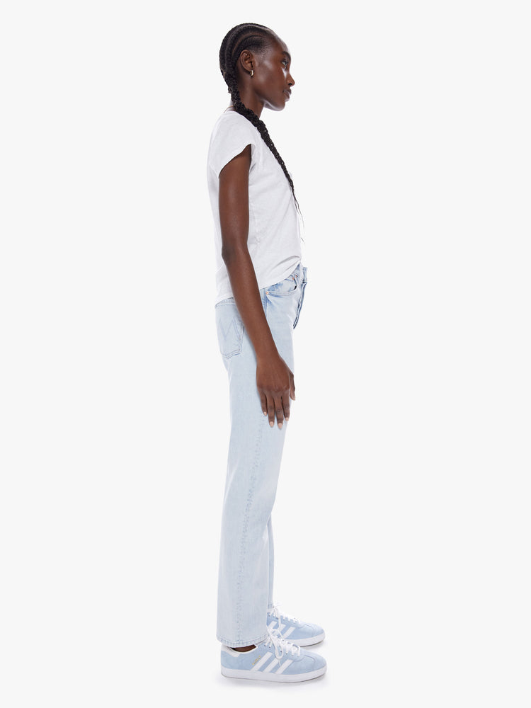 Side view of a woman slim straight-leg jean with button fly, low-set back pockets, a high waist and a 29-inch inseam.