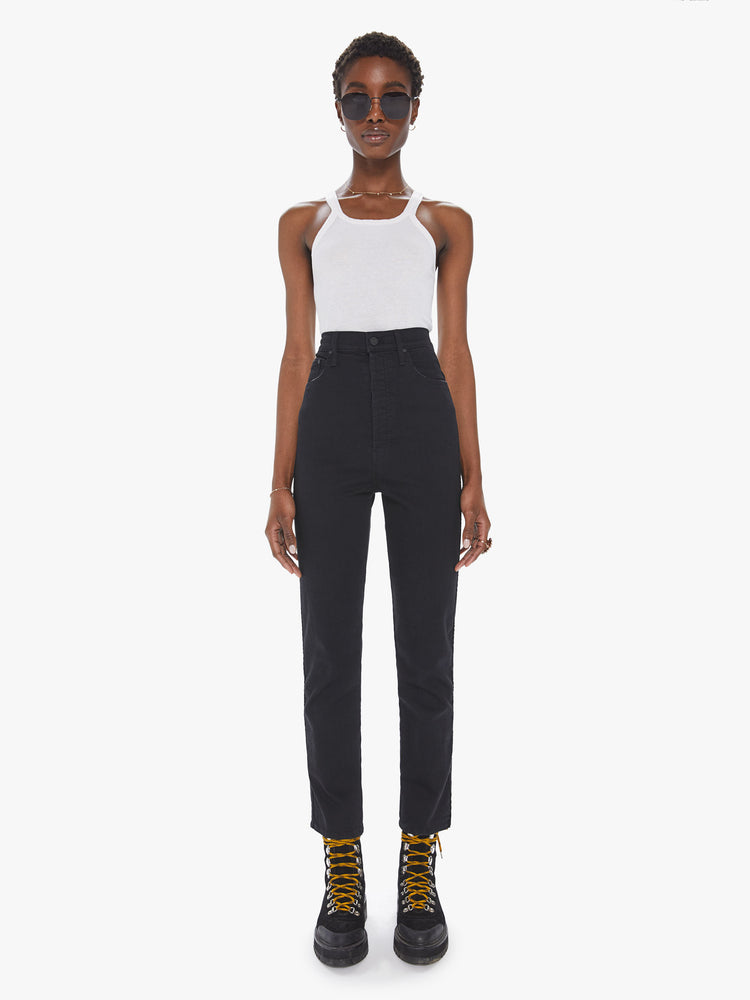 Front view of a womens black wash jean featuring a super high rise and a straight leg.