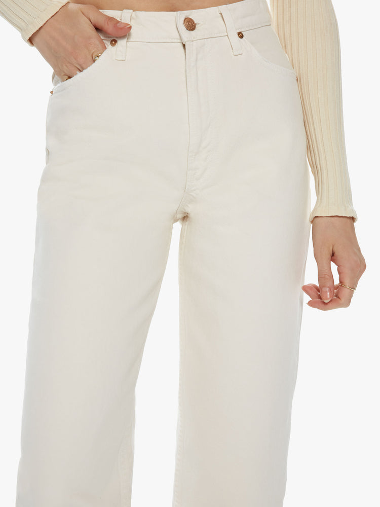 Front detail view of a women's ivory high waisted straight leg jean with an ankle length inseam. This style is inspired by the fit of 90s jeans.
