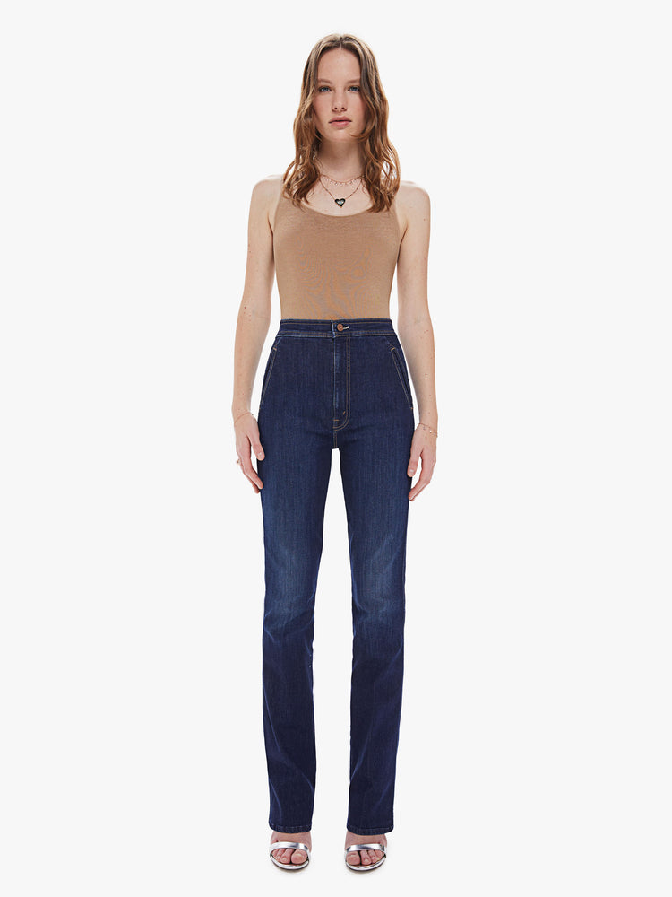 Front view of a women's dark blue high rise straight leg jean with a long clean hem