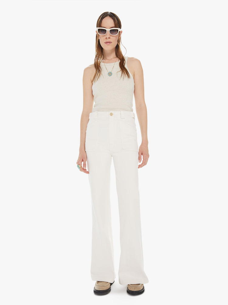 Front view of a womens off white pant, featuring a high rise, a wide relaxed leg, and patch pockets.