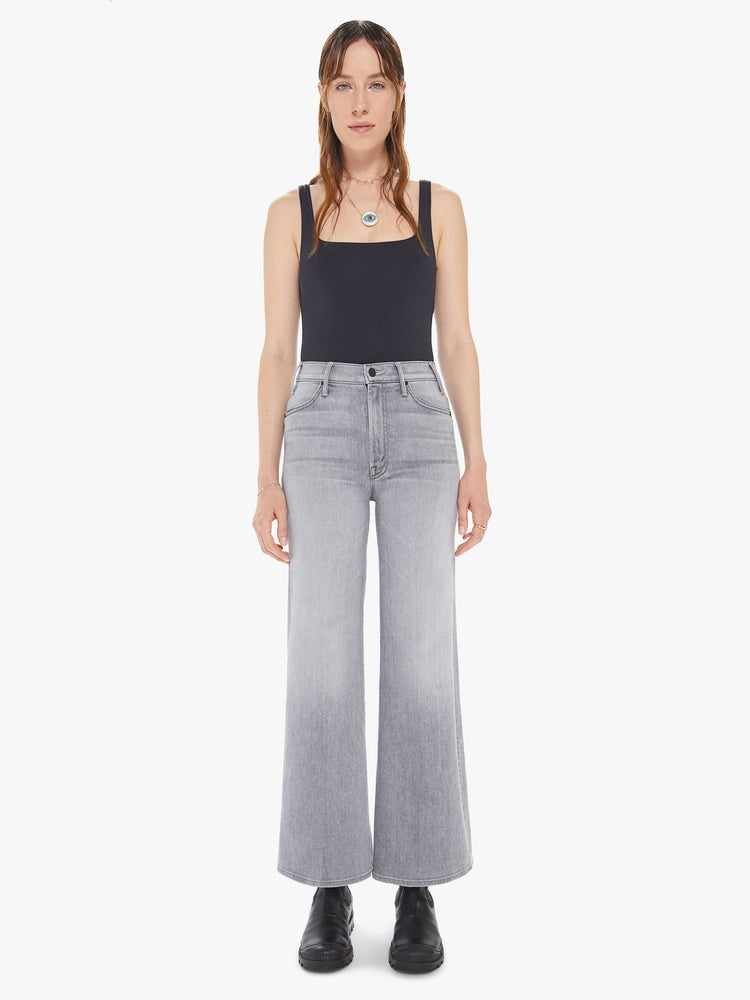 Front view of a womens light grey wash jean featuring a high rise, wide leg, and a clean ankle length hem.