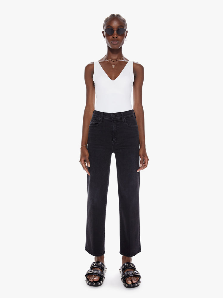 Front view of a womens black high waisted wide straight leg jean with an ankle length inseam and zip fly.