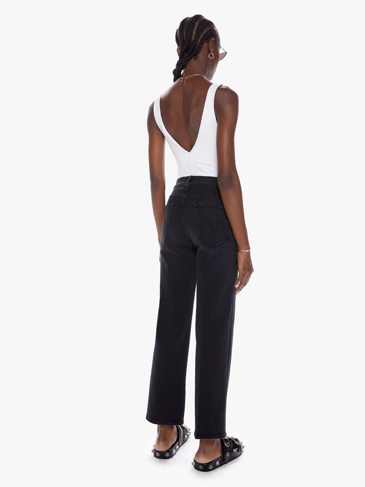 Back view of a womens black high waisted wide straight leg jean with an ankle length inseam and zip fly.