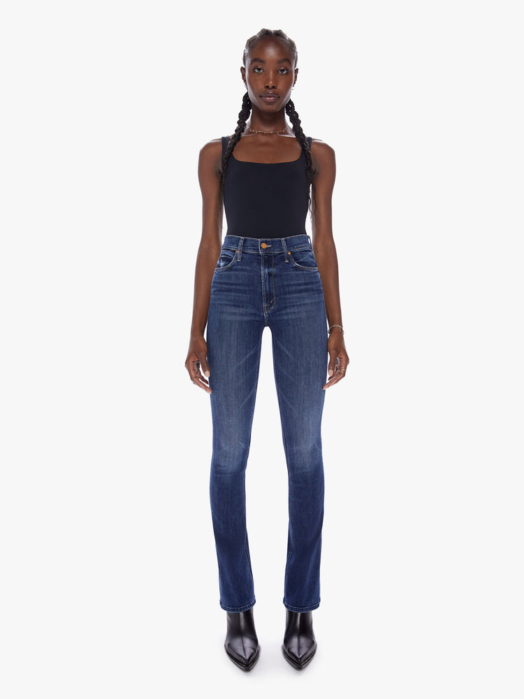 Front view of a dark blue wash denim skinny flare featuring a high rise.