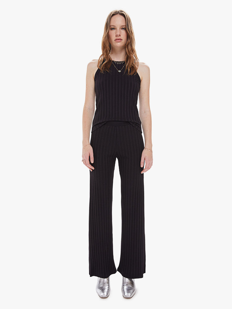 Front view of a women's black ribbed wide leg pant