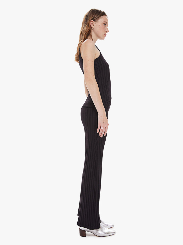 Side view of a women's black ribbed wide leg pant