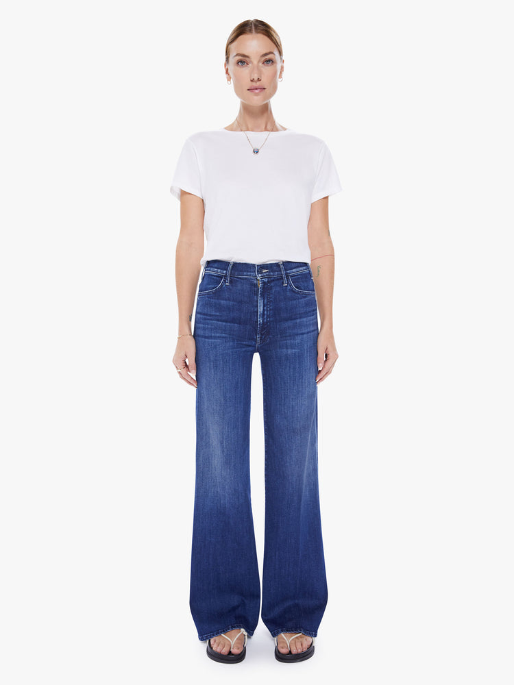 Front view of a woman wide leg jeans with a high rise, 32-inch inseam and a clean hem in a dark blue wash.