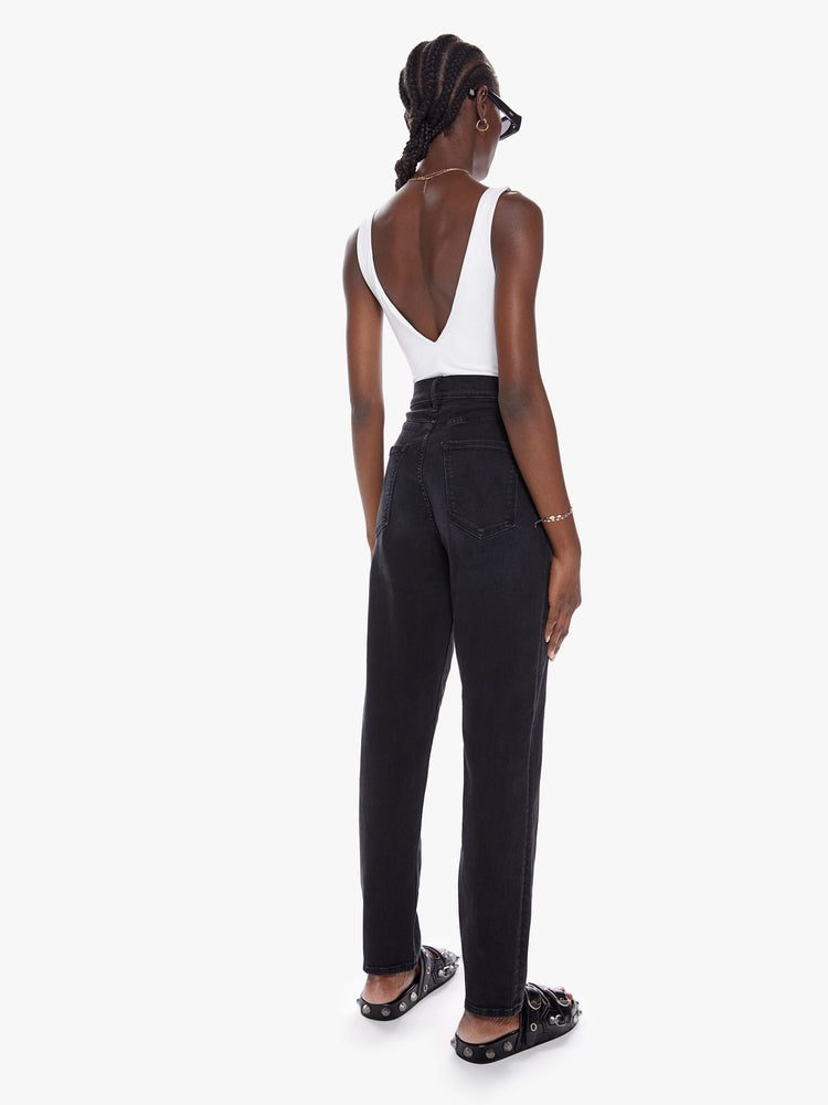 Back view of a black super high waisted jean with a straight leg and v-shaped seam at the waist, thighs and straight down the front.