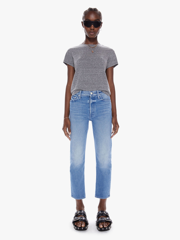 Front view of womens high rise medium blue wash jean with straight leg, ankle length inseam, button fly and fading at the knees.