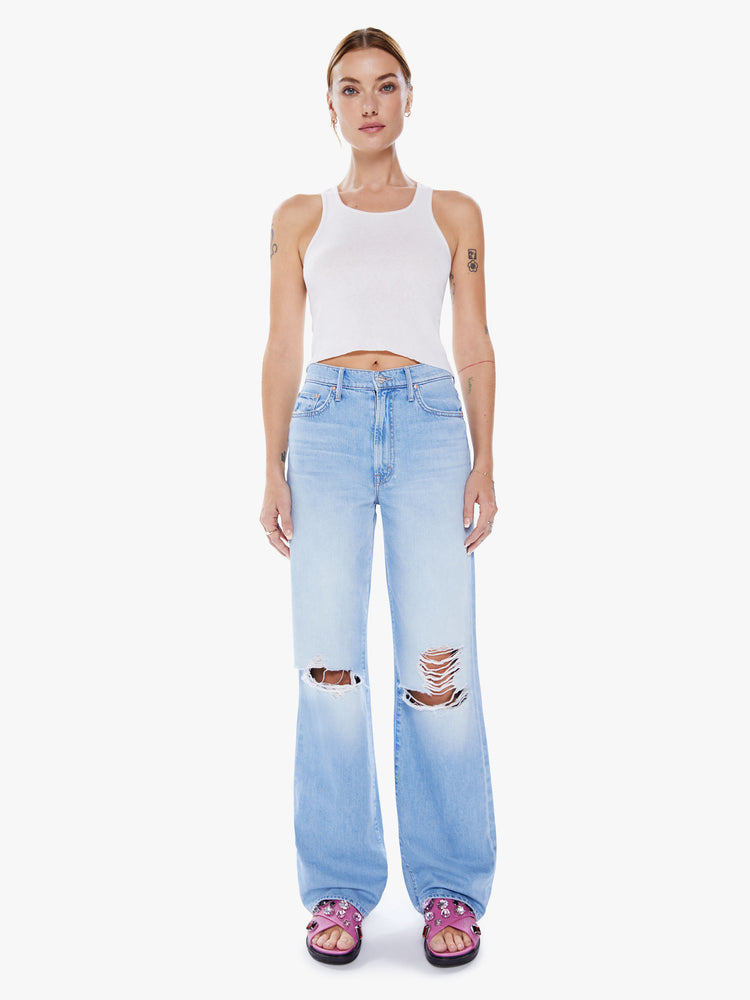 Front view of a woman's High-waisted jeans with a loose fit, wide leg and 34-inch inseam, with a clean hem in a light blue wash.