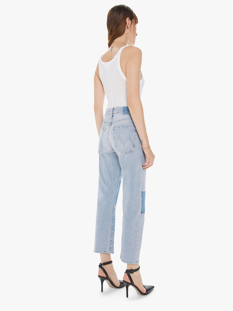 Back view of a women's light blue straight leg jean with a high rise, and a shadow effect over the front knee area