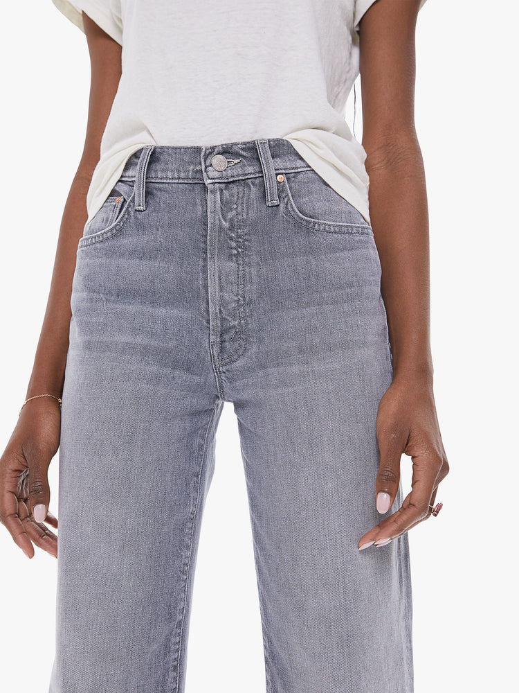 Front detail view of a women's light grey high rise straight leg jean with a clean ankle length hem