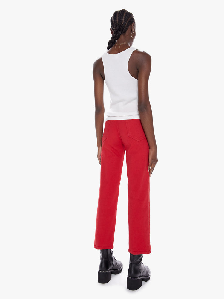 Back view of a womens bright red high waisted wide straight leg pant with an ankle length inseam and button fly.