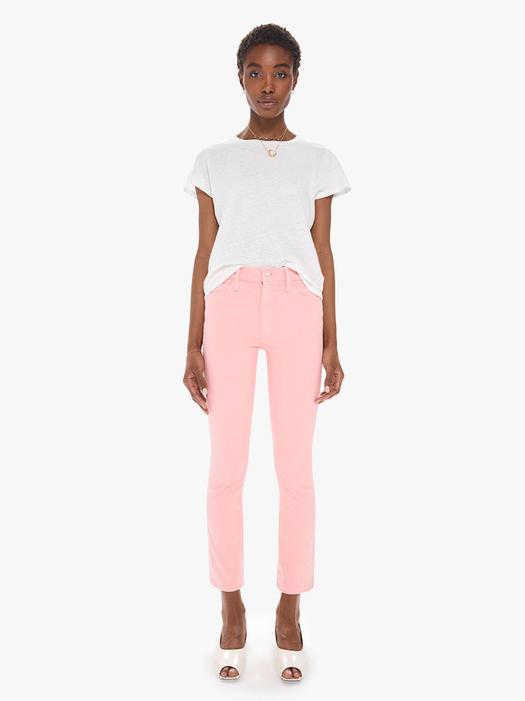 Front view of a women's light pink mid rise jean with a slim straight fit and an ankle length inseam