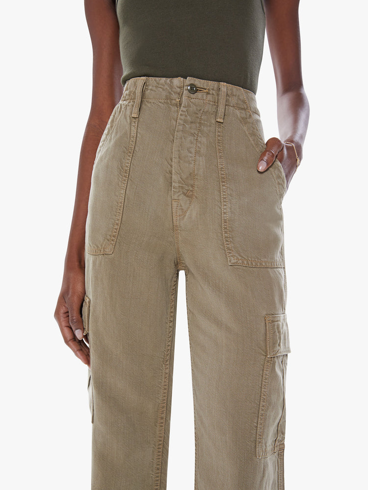 Close up waist view of a woman's High-waisted cargo pants with a wide straight leg, patch pockets and a clean 32-inch inseam in an olive green hue.