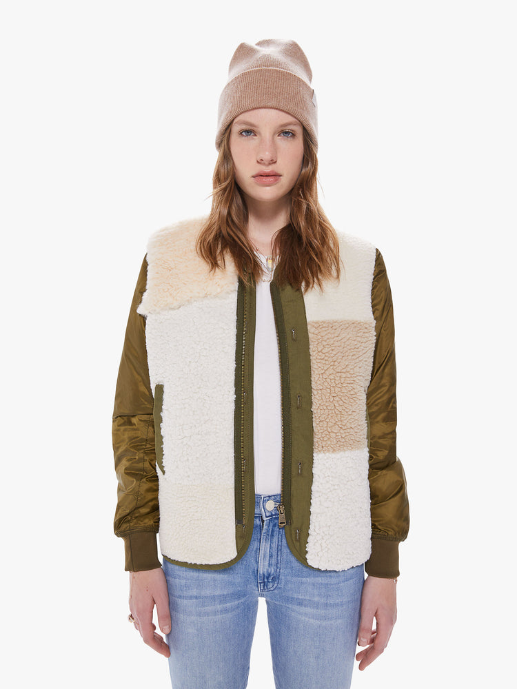Front view of a women's army green jacket with sherpa patchwork