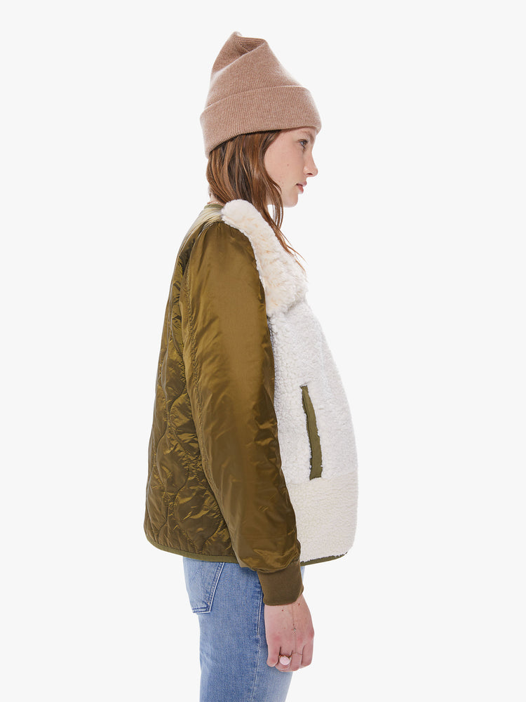 Side view of a women's army green jacket with sherpa patchwork