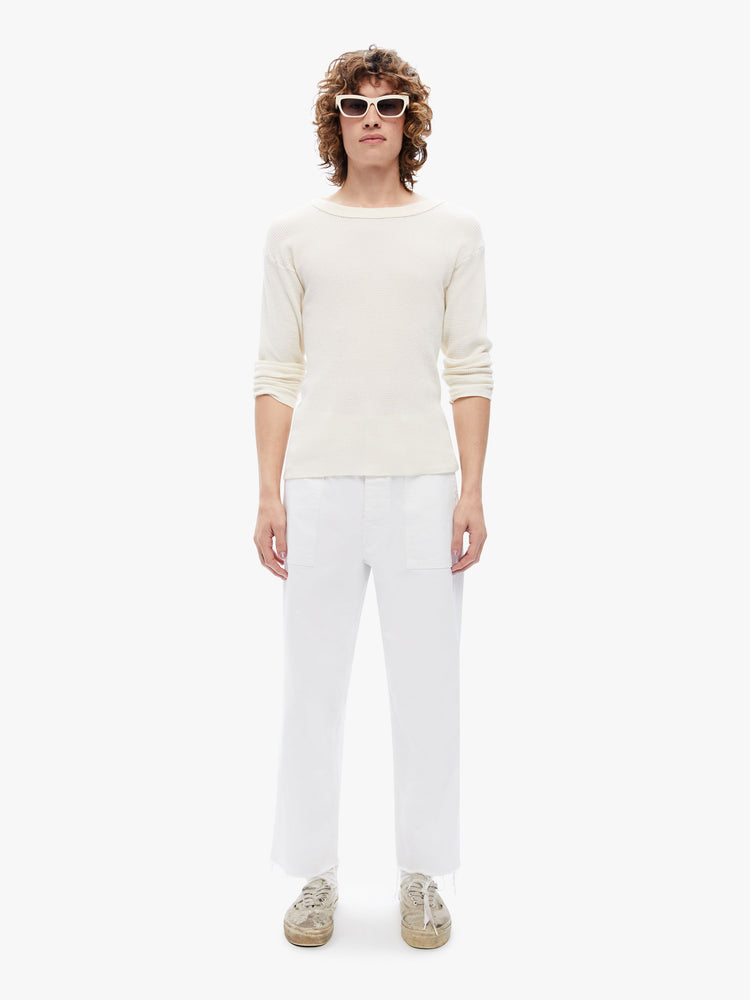 Front view of a mens military-inspired straight leg cargo pant with patch pockets and a cropped frayed hem in a bright white hue with tonal hardware.