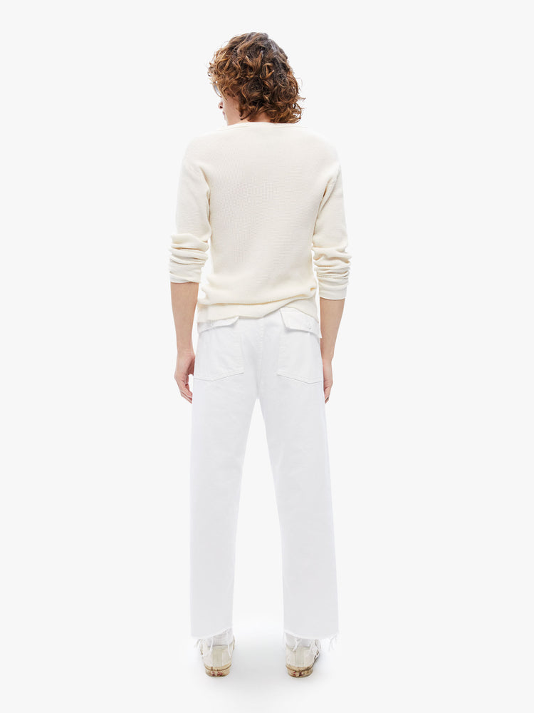 Back  view of a mens military-inspired straight leg cargo pant with patch pockets and a cropped frayed hem in a bright white hue with tonal hardware.