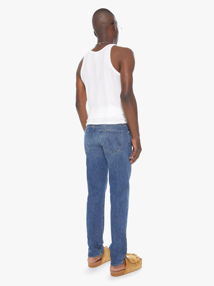 Back view of a men's medium blue straight leg jean