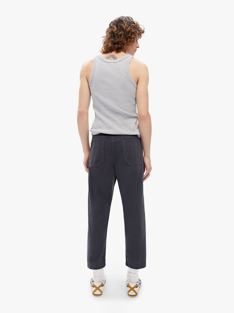 Back side view of mens classic chino with a jogger fit, drawstring waist and ankle-length inseam. Cut from a lightweight cotton blend with a touch of stretch in a faded black hue.