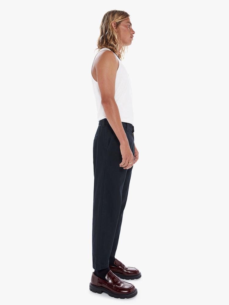 Side view of a men's black high waisted straight leg pant with a cropped hem