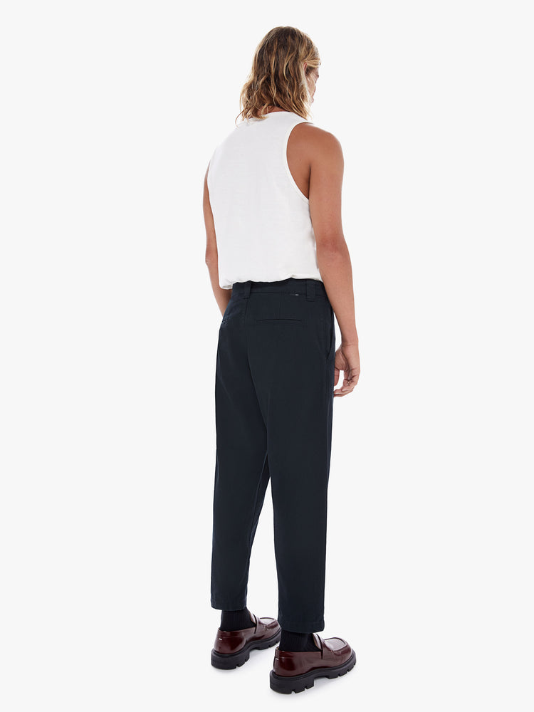 Back view of a men's black high waisted straight leg pant with a cropped hem