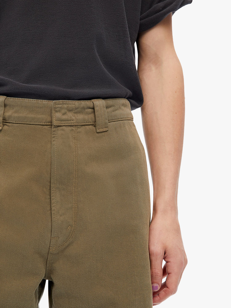 Close up view of mens straight, slightly tapered leg, ankle-length inseam and slash pockets pant in an army green hue