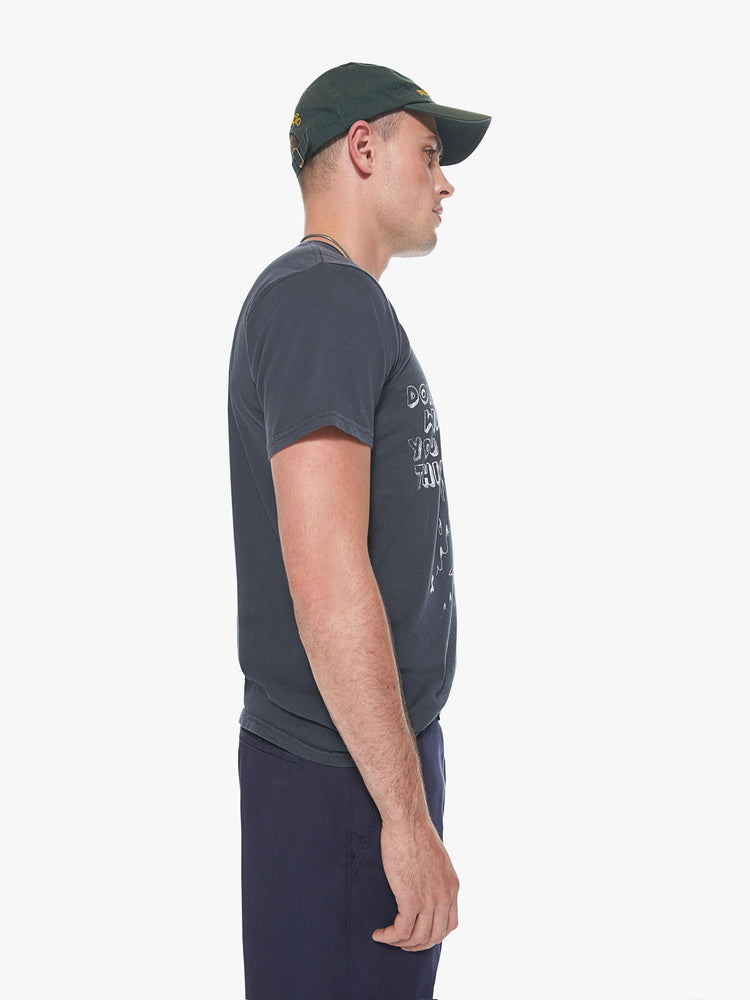 Side view of a men's charcoal t-shirt with a white graphic of a skeleton riding a surfboard through flames with "Don't worry you got this" printed in boxy font