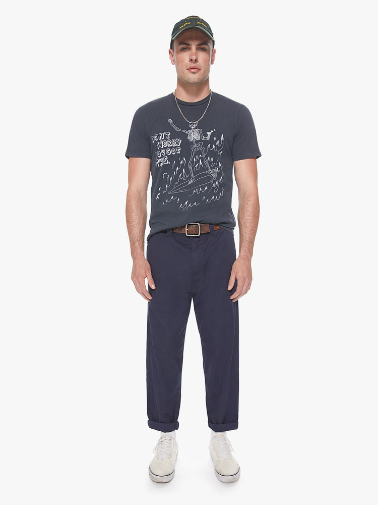 Full front view of a men's charcoal t-shirt with a white graphic of a skeleton riding a surfboard through flames with "Don't worry you got this" printed in boxy font