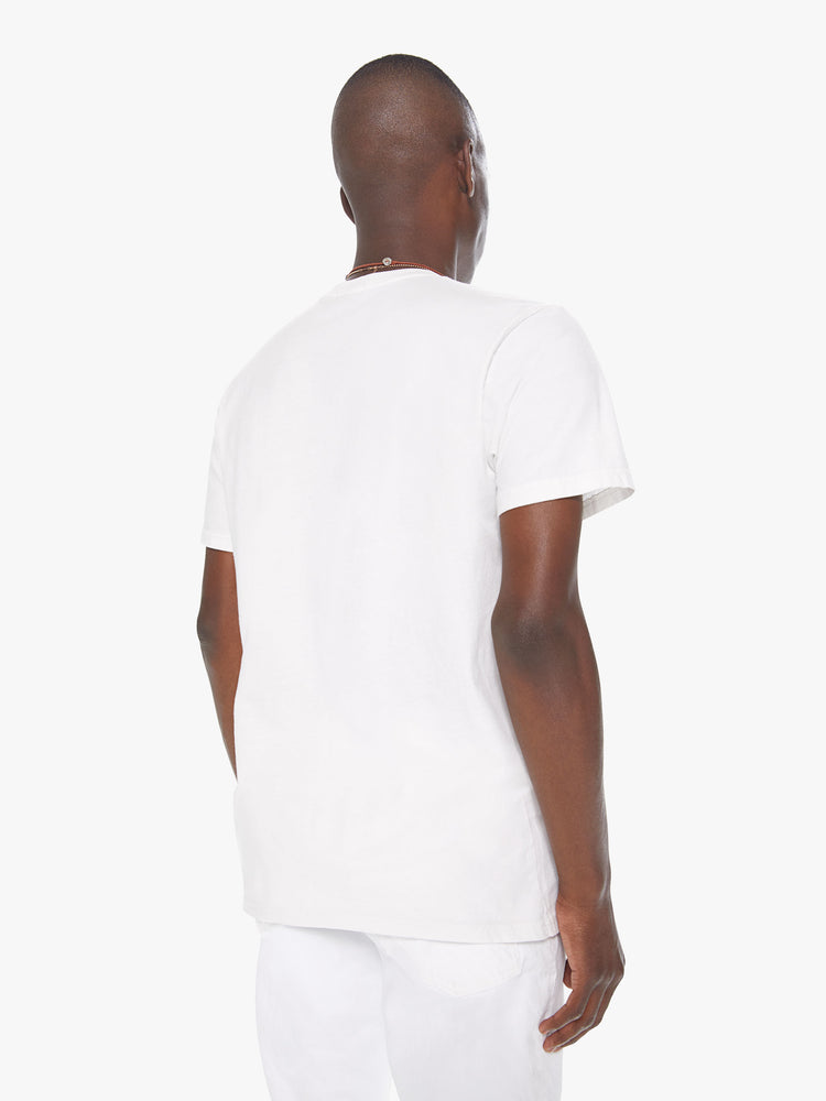 Back view of a men's white t-shirt with "veggie" printed in faded green lettering