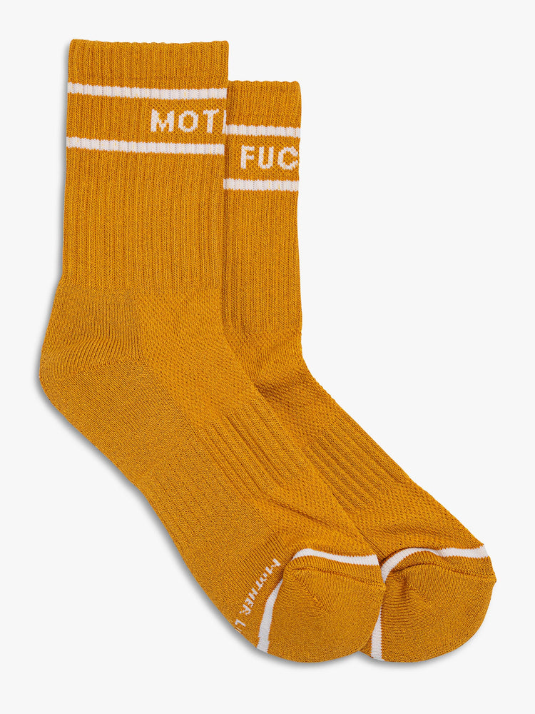 Flat view of a pair of deep yellow socks featuring white stripes and the words "MOTHER" "FUCKER".