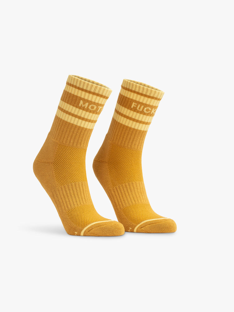 Front view of a gold sock with light yellow tube stripes and "MOTHER FUCKER" graphic