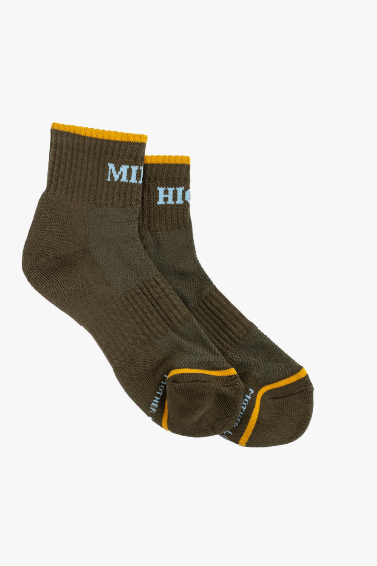 A pair of olive green ankle socks featuring yellow trim and the words "MILE" and "HIGH" in light blue.