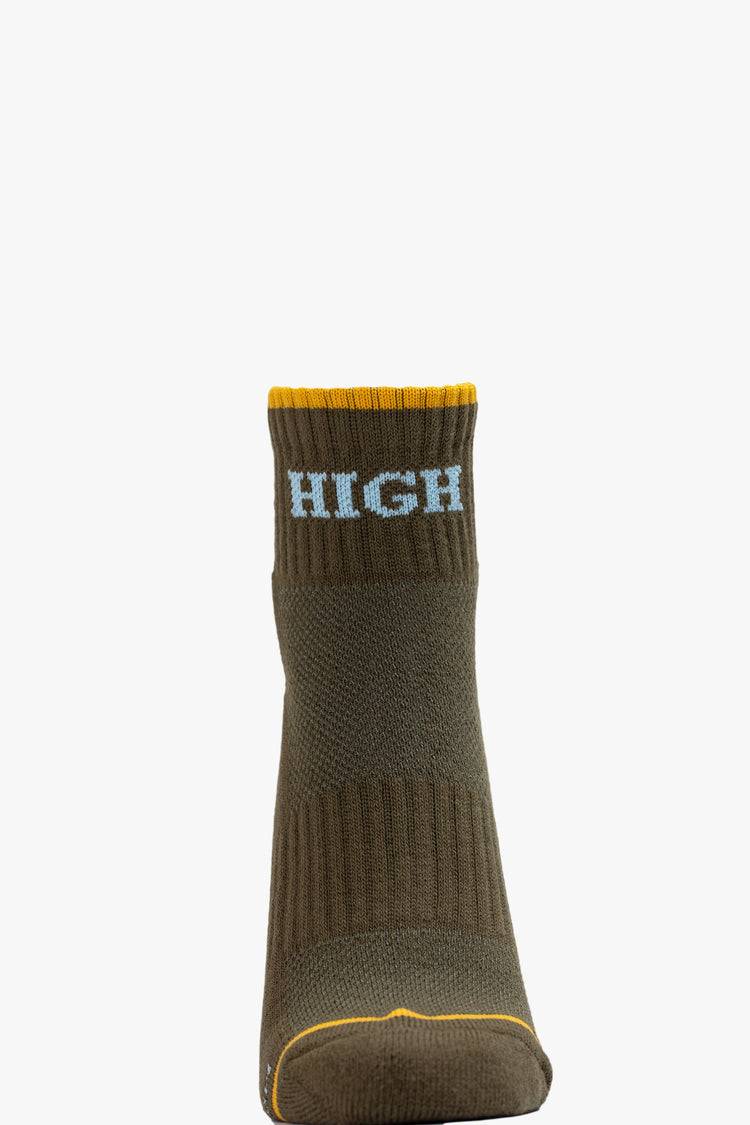 Front view of a green ankle sock featuring yellow trim and the word "HIGH" in light blue.