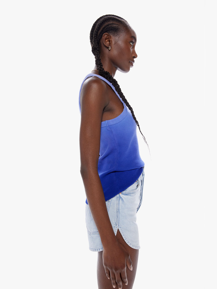 Side view of a woman dip dyed periwinkle hue Tank features a slim fit and racer-style straps.