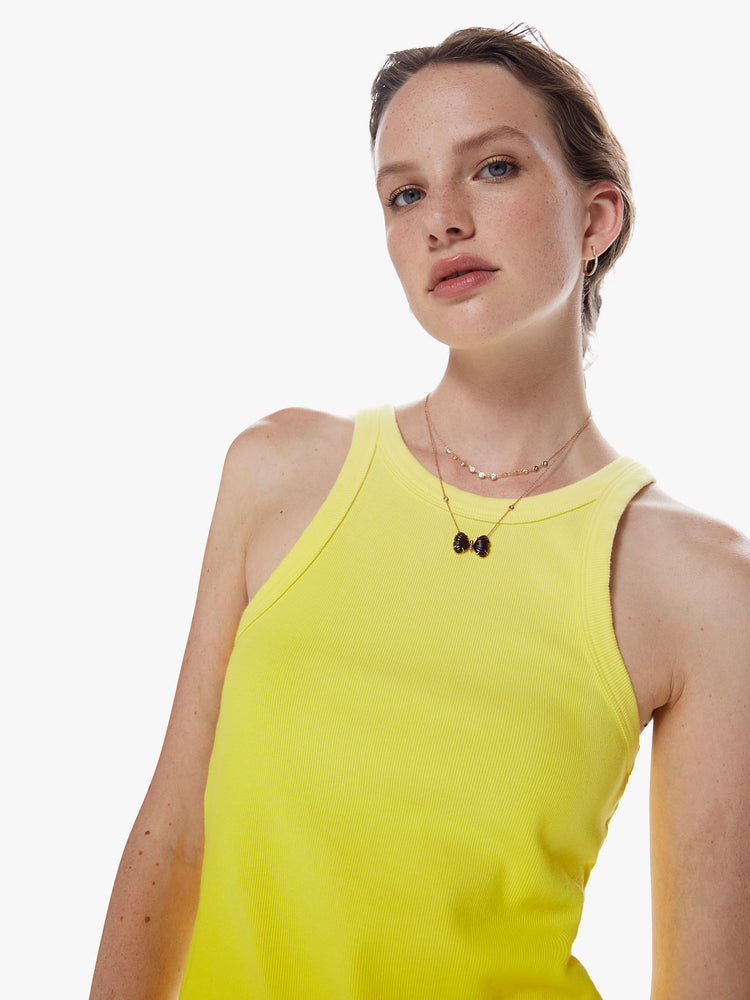 Close up view of a dip dyed yellow hue view of a woman dip dyed periwinkle hue Tank features a slim fit and racer-style straps.