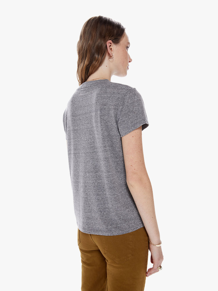 Back view of a woman in a soft crewneck with a slim fit for a vintage look and feel made from a cotton blend in a heathered grey hue, the tee features a faded cobra snake graphic in red and paint smears on the front