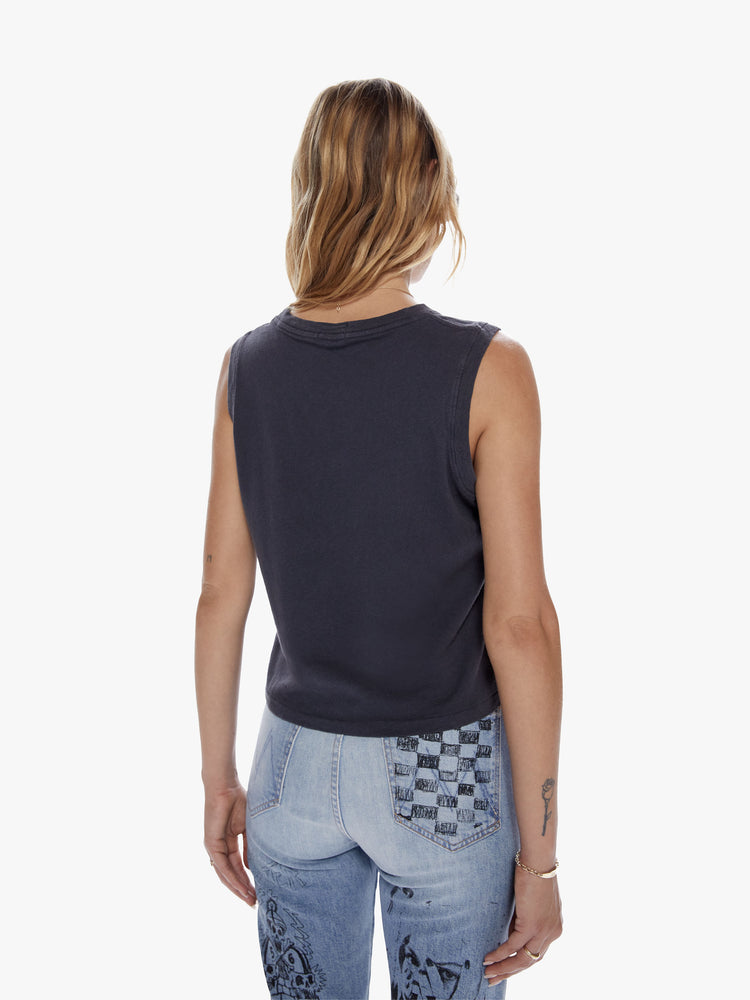 Back view of a woman in a cropped muscle tee with a crewneck and boxy fit, cut from a recycled cotton blend the dark grey tank features a bold text of This Aint No Disco in yellow on the front
