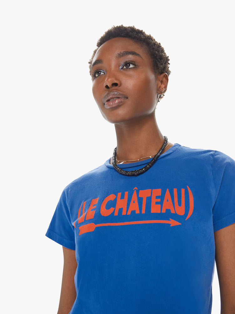Front close up view of a womens blue crew neck tee featuring a fitted body and a red graphic reading "LE CHATEAU".