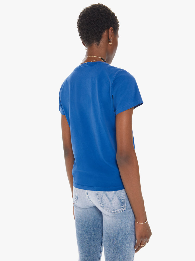Back view of a womens blue crew neck tee featuring a fitted body and a red graphic reading "LE CHATEAU".