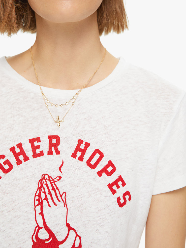 Closer up view of a womens knit tee features a red graphic on the front with some wishful thinking from MOTHER.
