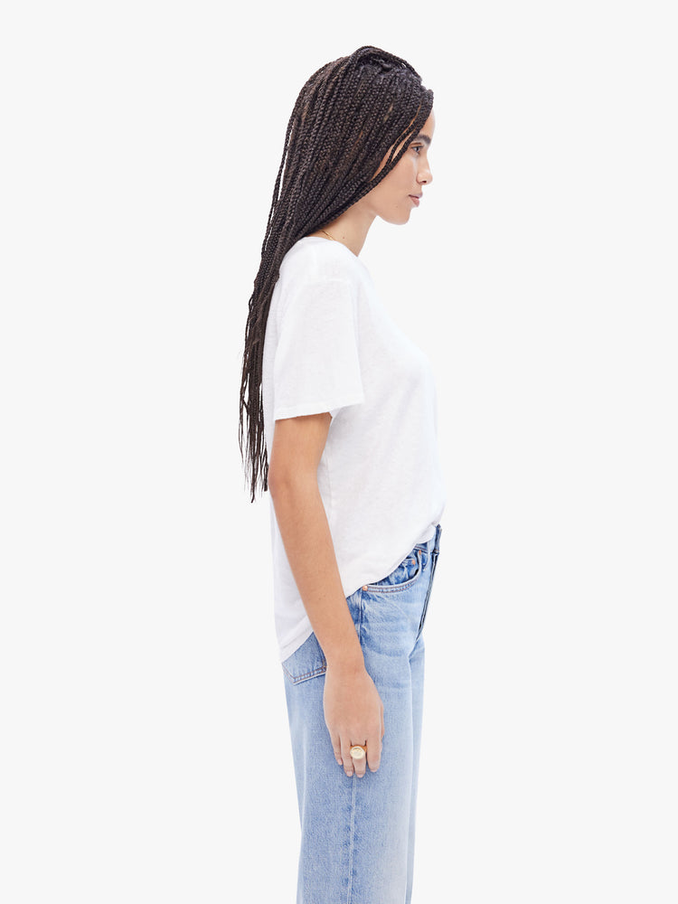Side view of a womens white crew neck tee in a slub fabric featuring an oversized fit.
