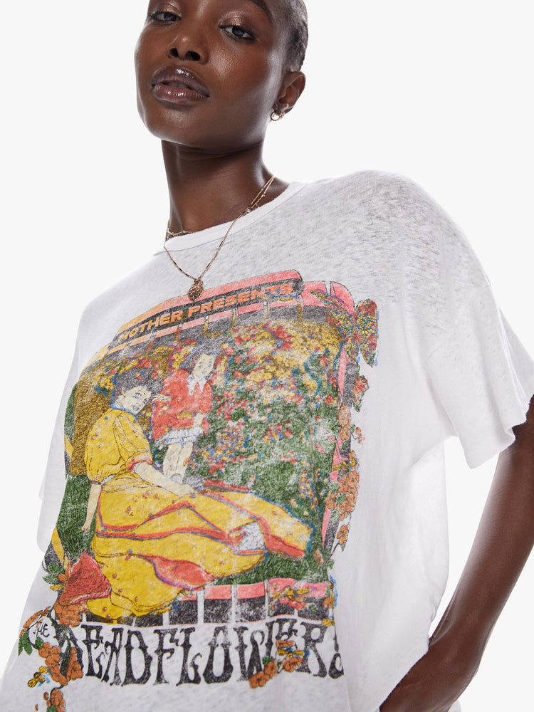 Close up front view of a woman in an oversize tee with drop shoulders and a loose, boxy fit designed in a superior blend of cotton and linen that features text reminiscent of The Grateful Dead