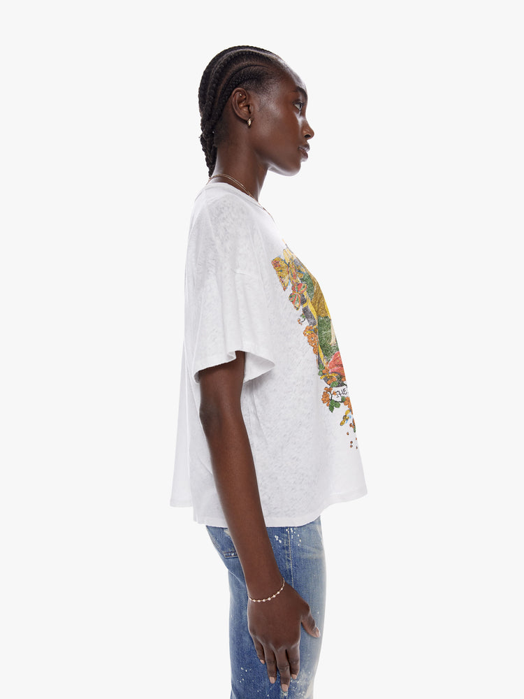 Side view of a woman in an oversize tee with drop shoulders and a loose, boxy fit designed in a superior blend of cotton and linen that features text reminiscent of The Grateful Dead