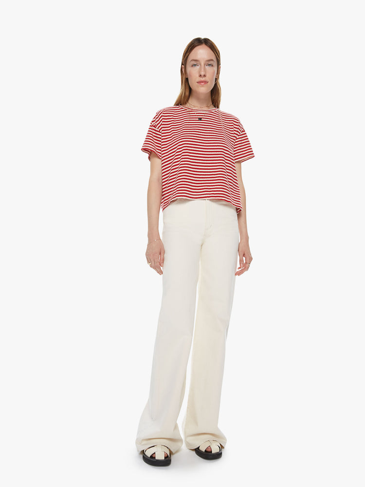Front full body view of a red a white striped crew neck tee featuring dropped shoulders and a boxy cropped fit.