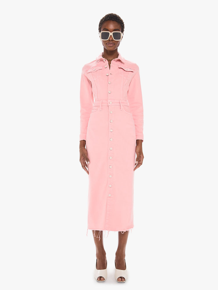 Front view of a women's light pink button down denim dress with a long sleeves and a frayed midi length hem